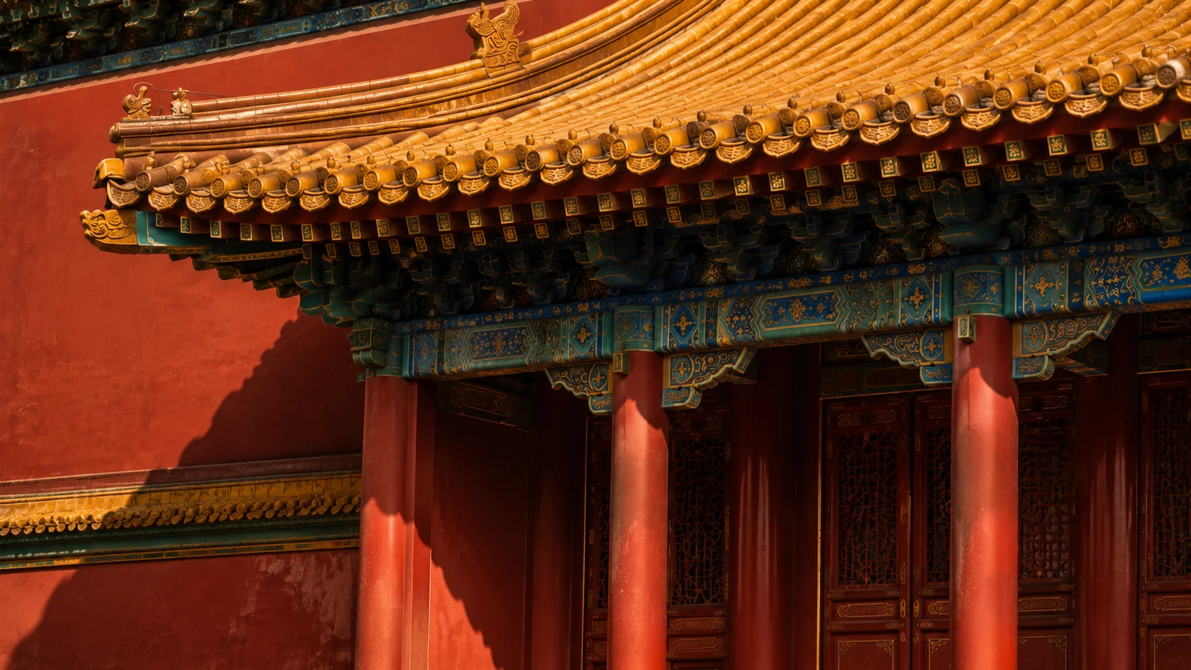 Vermilion red columns supporting imperial yellow glazed roof tiles in Forbidden City architecture
